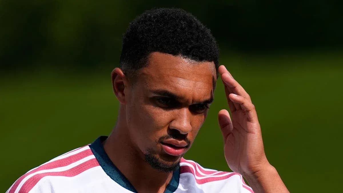 Player touching forehead during training session Player touching forehead during training session
