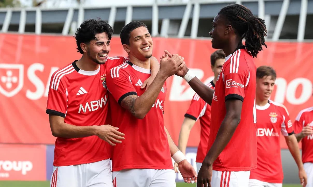 Benfica players celebrating together on the field Benfica players celebrating together on the field