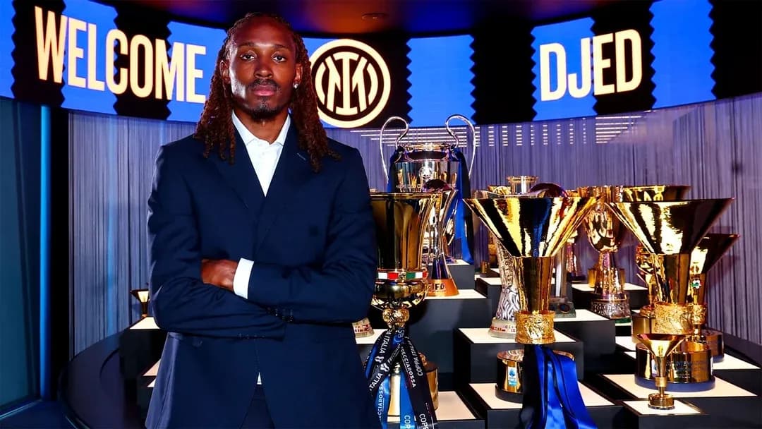 Player posing with trophies at welcome event Player posing with trophies at welcome event