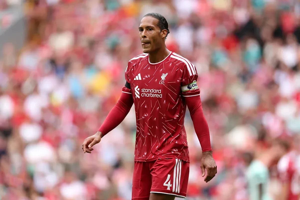 Liverpool player wearing red kit on the pitch Liverpool player wearing red kit on the pitch