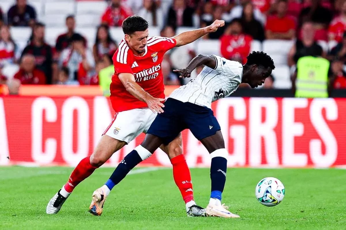 Benfica player challenging Aarhus opponent for the ball Benfica player challenging Aarhus opponent for the ball
