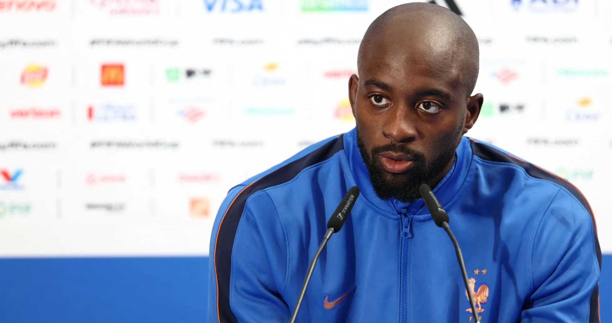 Player speaking at a press conference podium Player speaking at a press conference podium