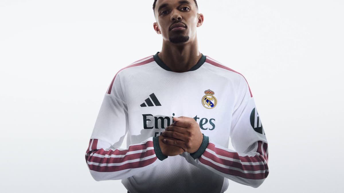 Player wearing Real Madrid jersey posing confidently Player wearing Real Madrid jersey posing confidently