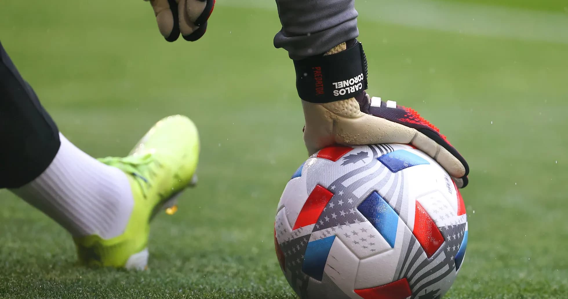 Goalkeeper placing ball on grass before kick Goalkeeper placing ball on grass before kick
