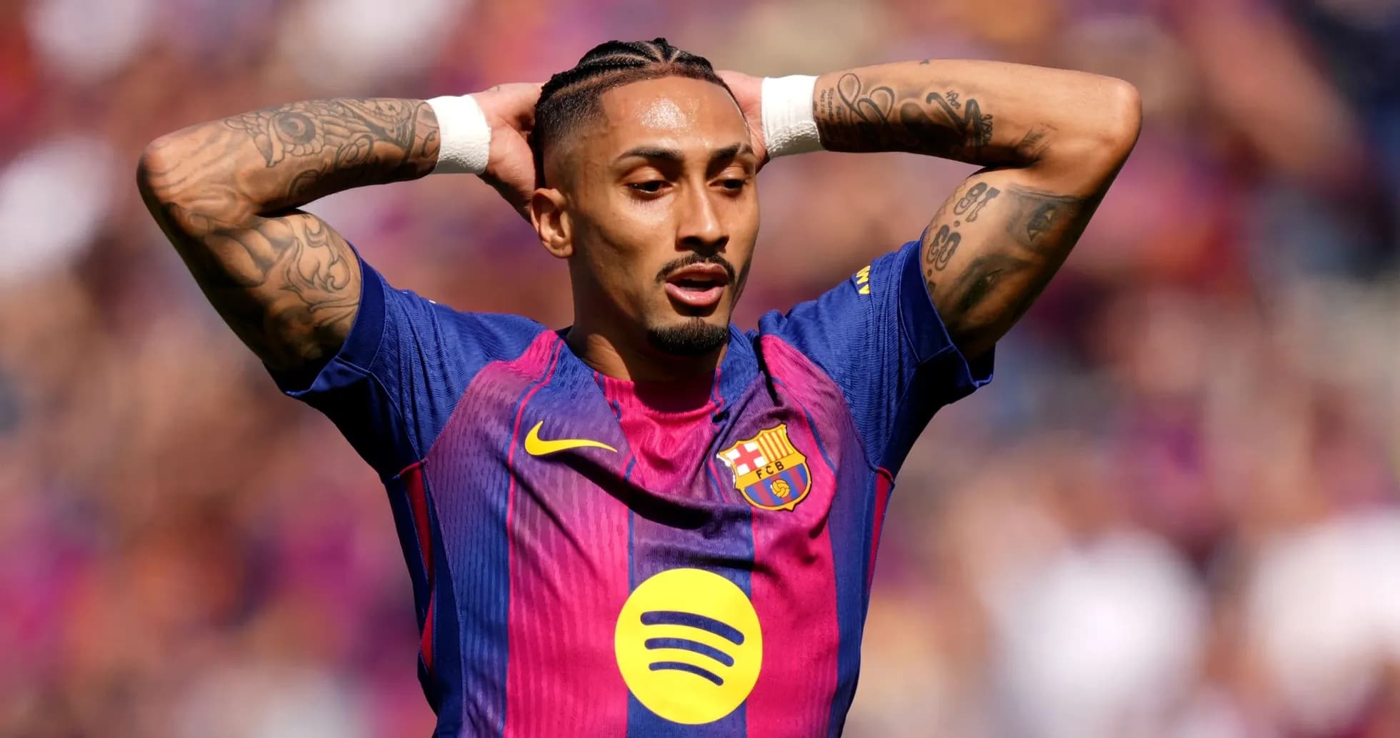 Player with tattoos in Barcelona jersey during match Player with tattoos in Barcelona jersey during match