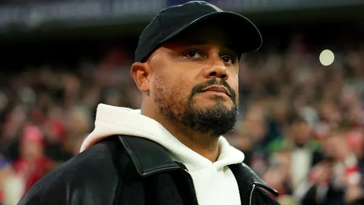 Man wearing a black cap and jacket at stadium Man wearing a black cap and jacket at stadium