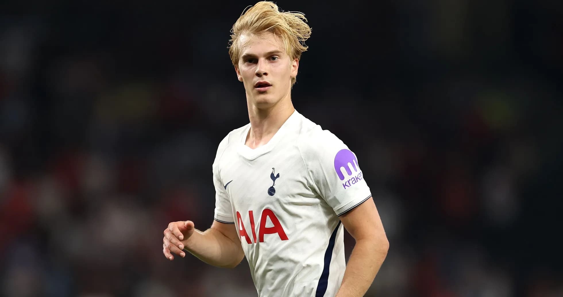 Player in Tottenham kit running on the pitch Player in Tottenham kit running on the pitch