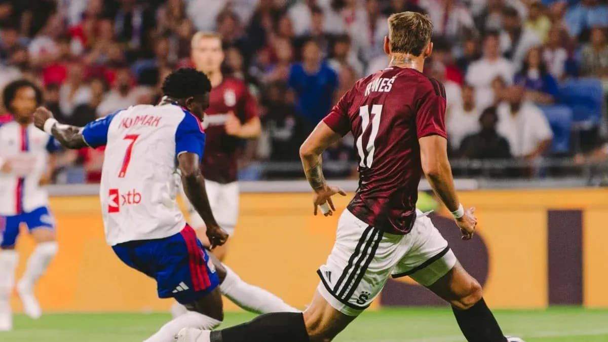 Lyon player dribbling against Sparta Praha defender Lyon player dribbling against Sparta Praha defender