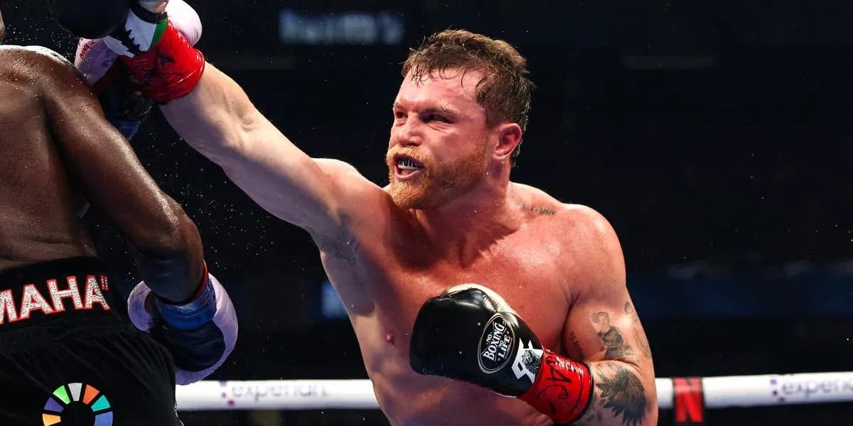 Boxer throwing a punch during a match Boxer throwing a punch during a match