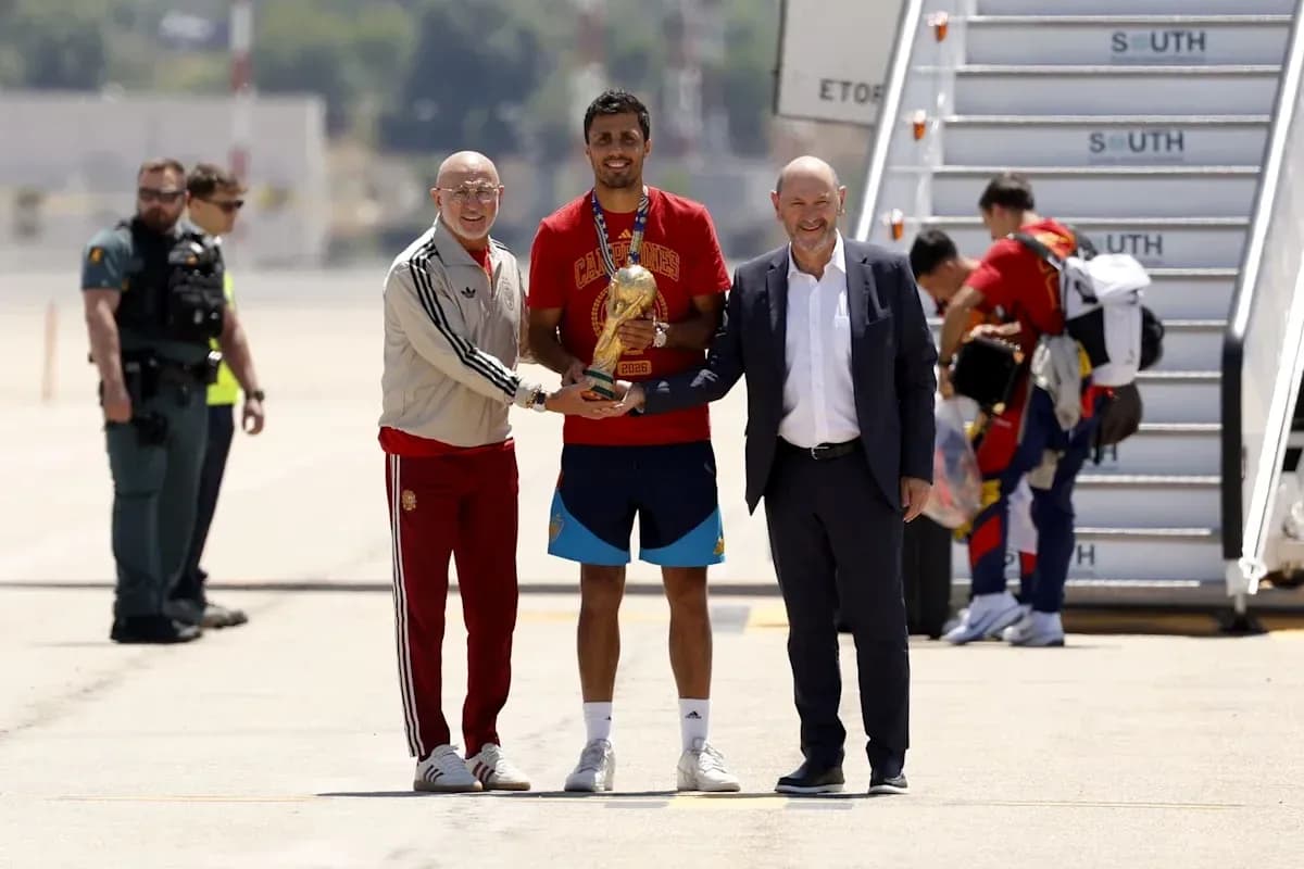 Player receiving trophy at arrival airport ceremony Player receiving trophy at arrival airport ceremony