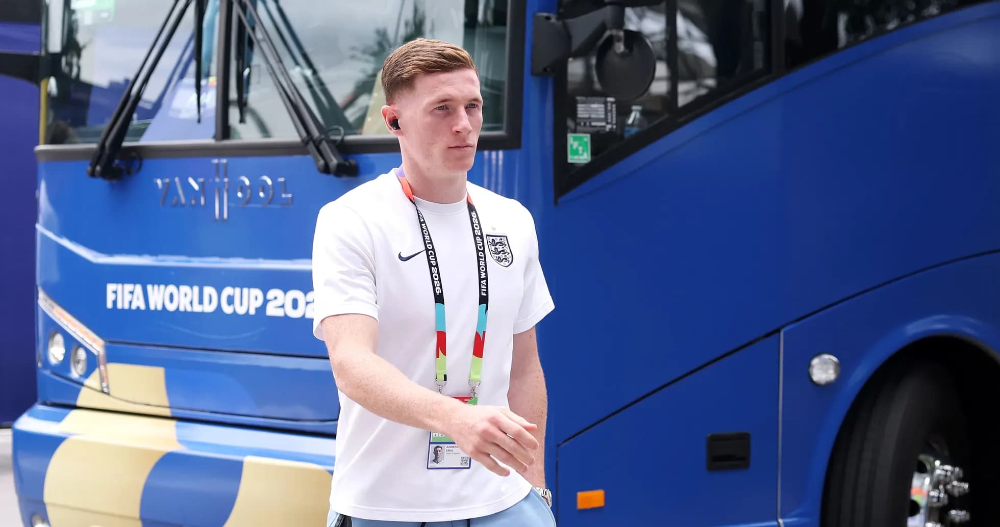 Player walking near FIFA World Cup team bus Player walking near FIFA World Cup team bus