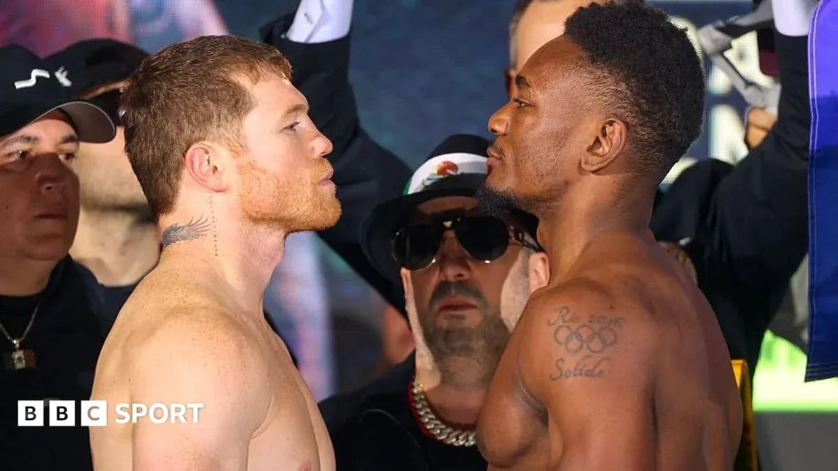 Two boxers facing off at weigh-in event Two boxers facing off at weigh-in event