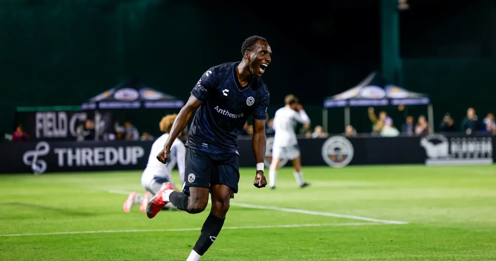 Player celebrating after scoring a goal in match Player celebrating after scoring a goal in match