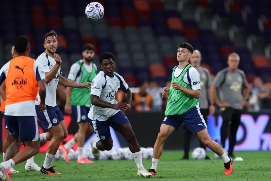 Players training and practicing ball control on pitch Players training and practicing ball control on pitch