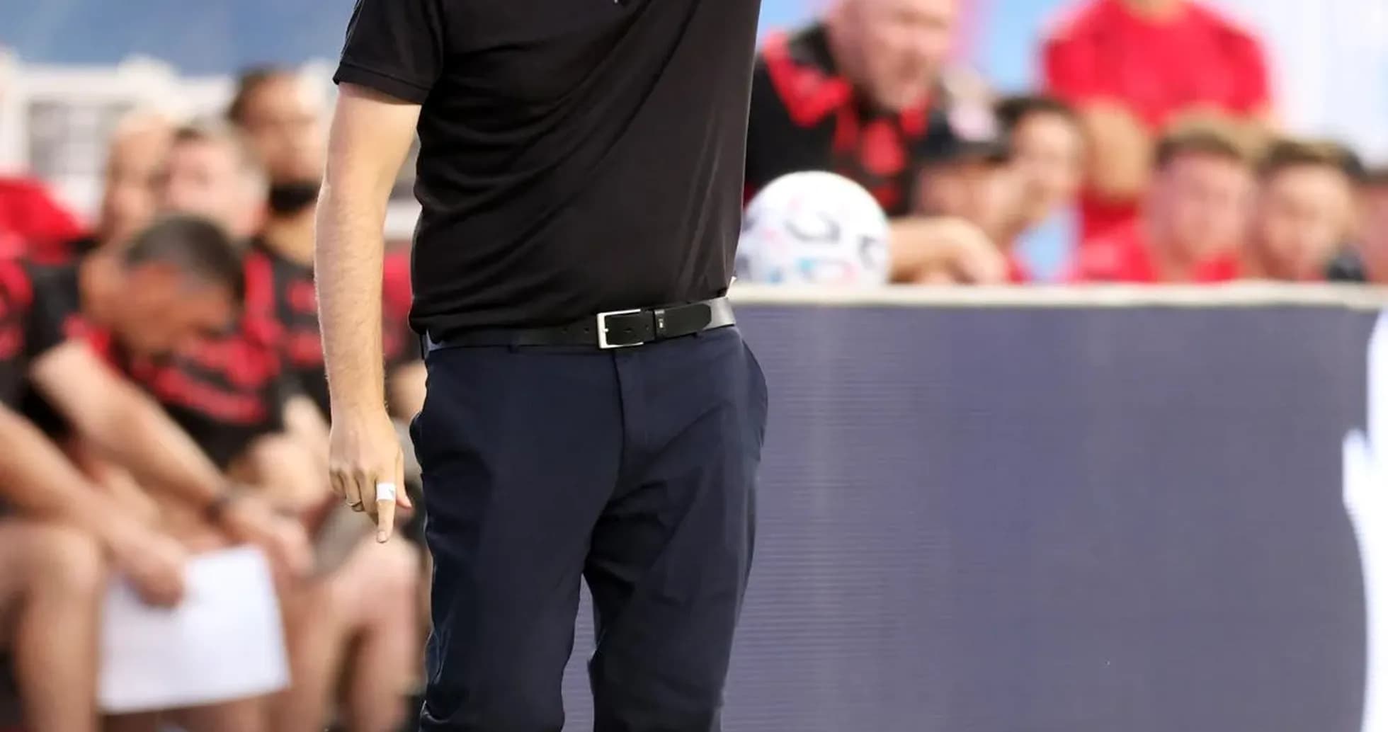 Coach giving instructions from the sideline during match Coach giving instructions from the sideline during match