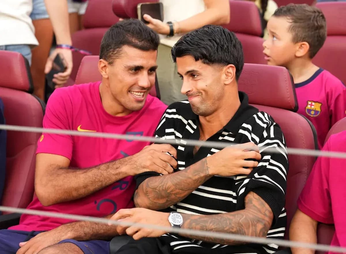 Two players interacting in stadium seats during event Two players interacting in stadium seats during event