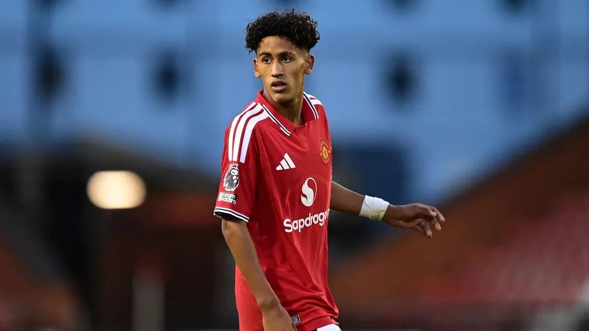 Player wearing Manchester United kit on the field Player wearing Manchester United kit on the field