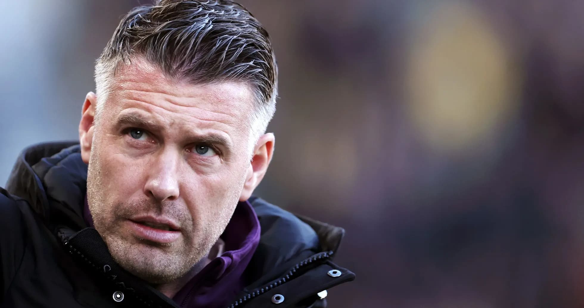 Coach looking focused during match on sideline Coach looking focused during match on sideline