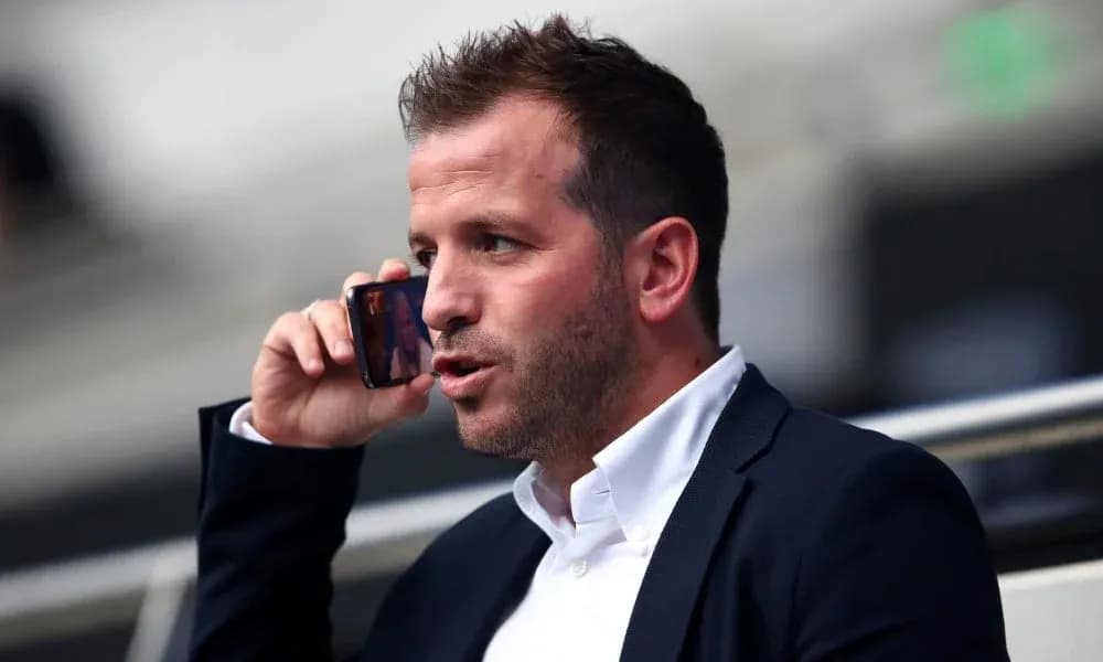 Man speaking on the phone in a stadium Man speaking on the phone in a stadium