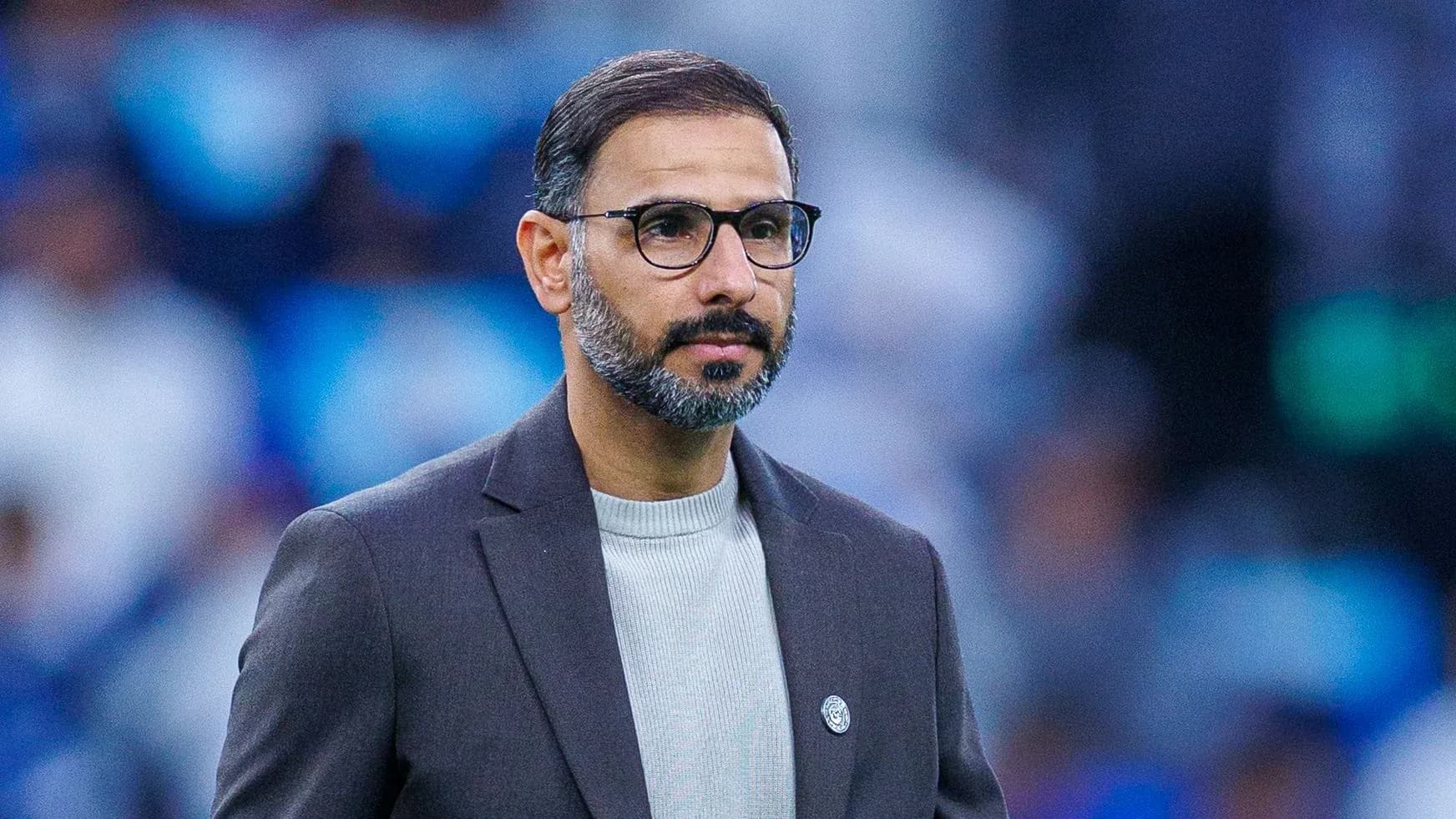 Coach observing match from the sidelines Coach observing match from the sidelines