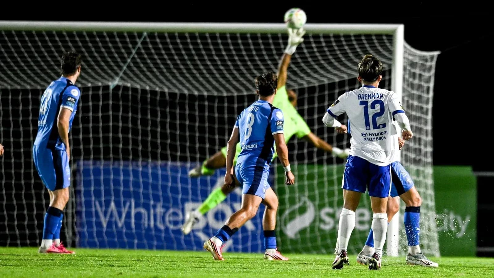 Goalkeeper making a save during soccer match Goalkeeper making a save during soccer match