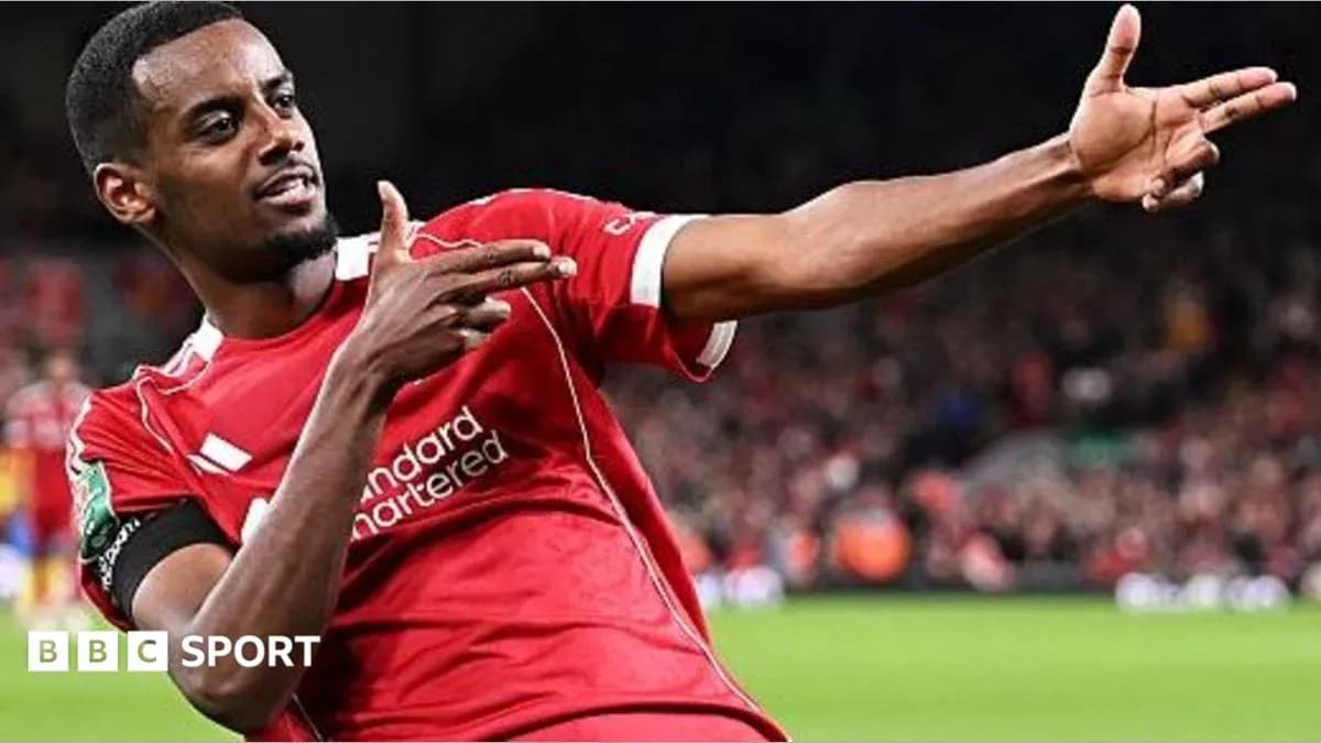 Player celebrating a goal in Liverpool jersey Player celebrating a goal in Liverpool jersey