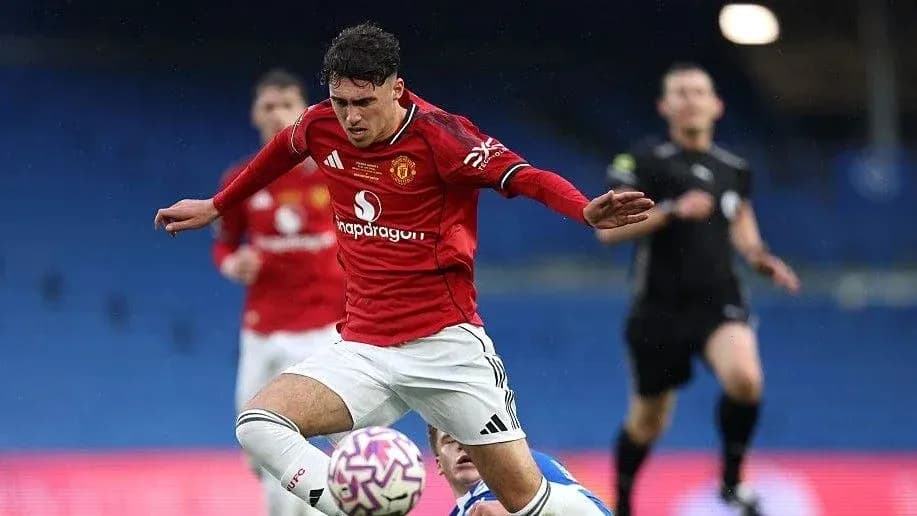 Player in red jersey falling during football match Player in red jersey falling during football match