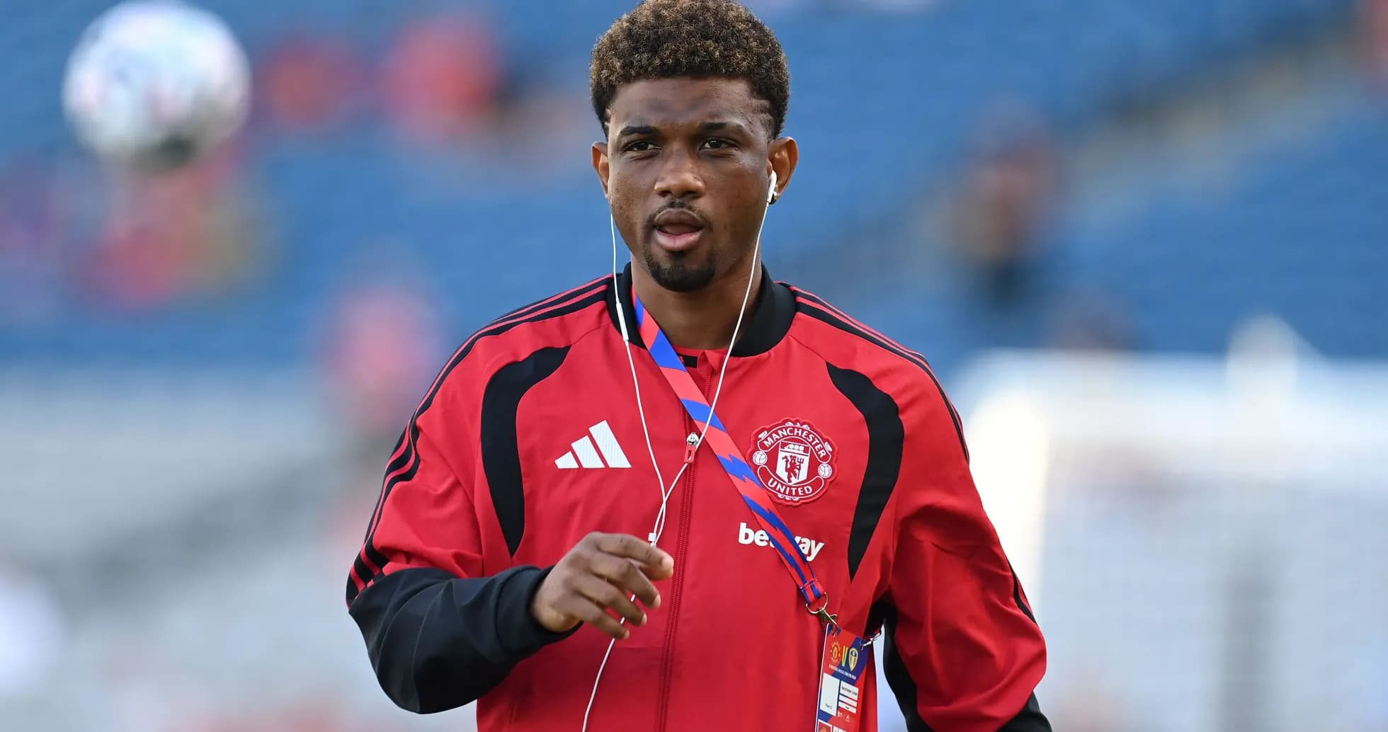 Player in Manchester United jersey warming up Player in Manchester United jersey warming up