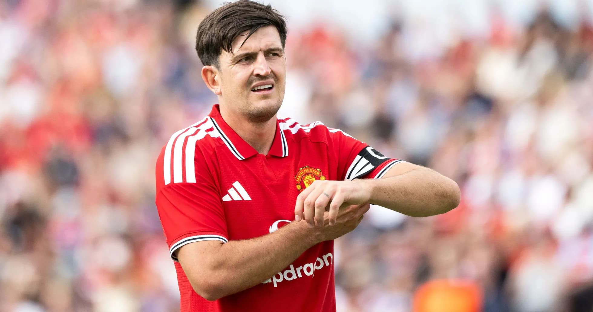 Player adjusting his wrist during match for Manchester United Player adjusting his wrist during match for Manchester United