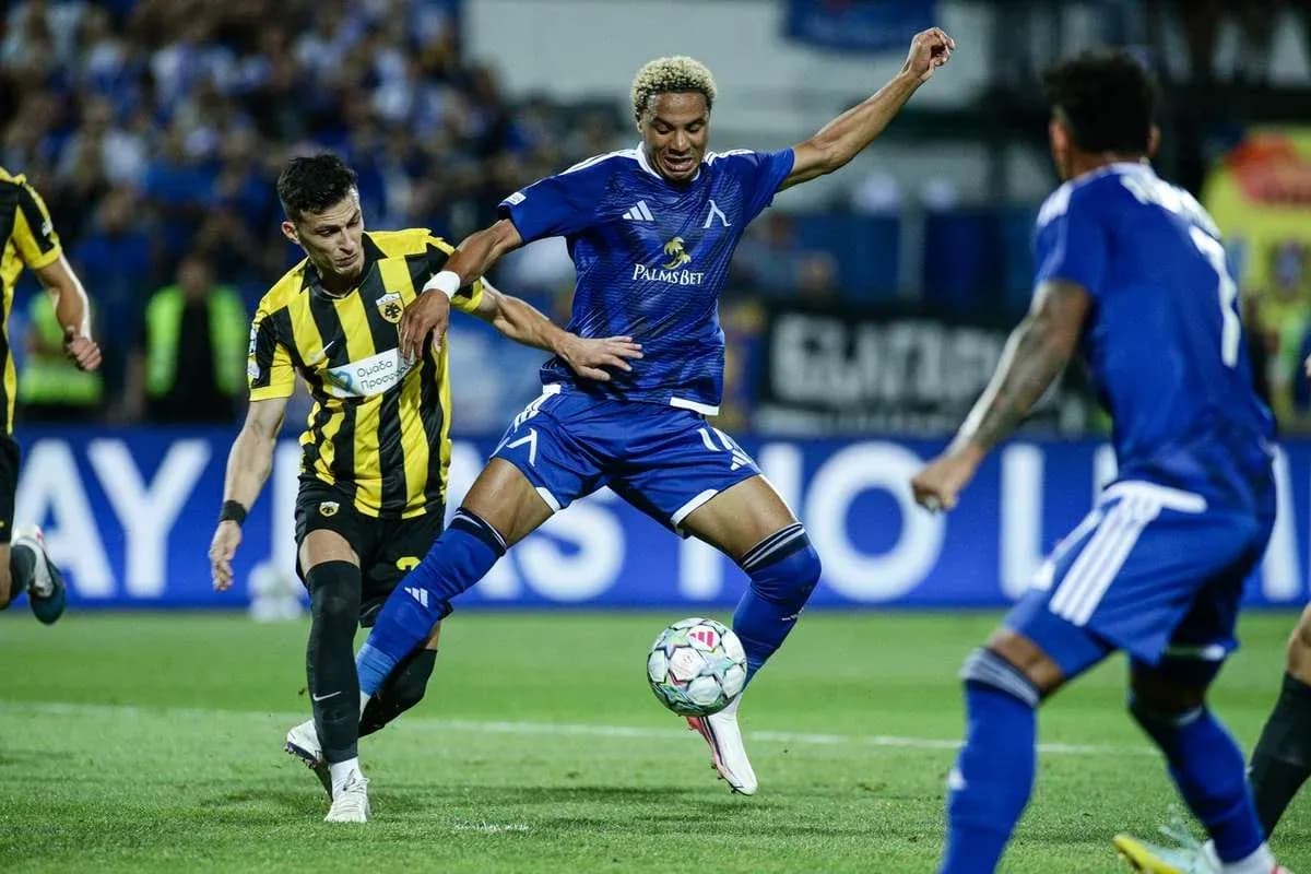 Levski Sofia player dribbling against AEK Athens Levski Sofia player dribbling against AEK Athens