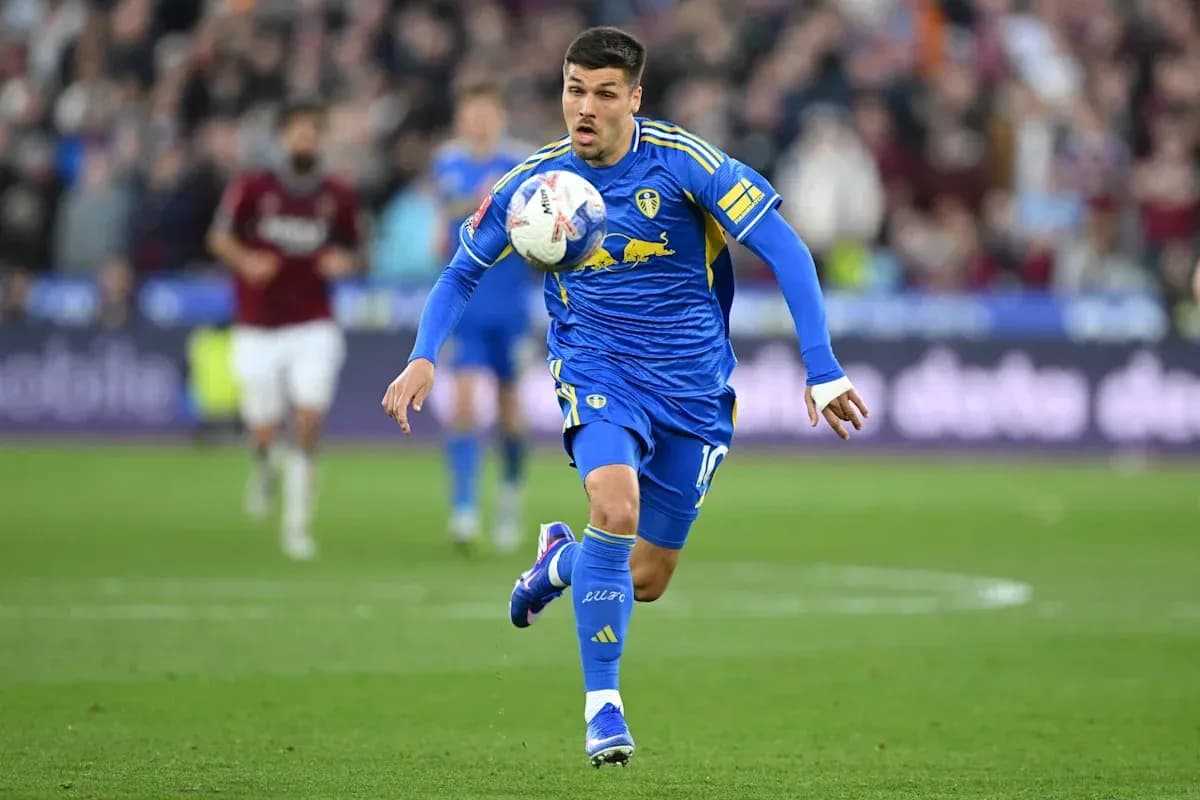 Player dribbling the ball during a match Player dribbling the ball during a match