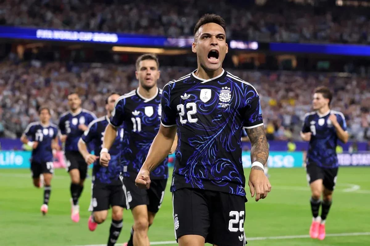 Argentina players celebrating a goal on the pitch Argentina players celebrating a goal on the pitch