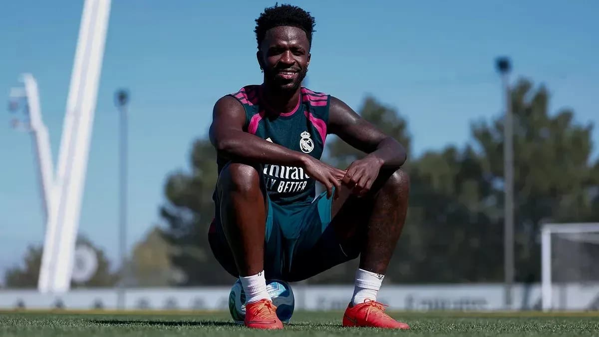 Player sitting on a ball during training session Player sitting on a ball during training session