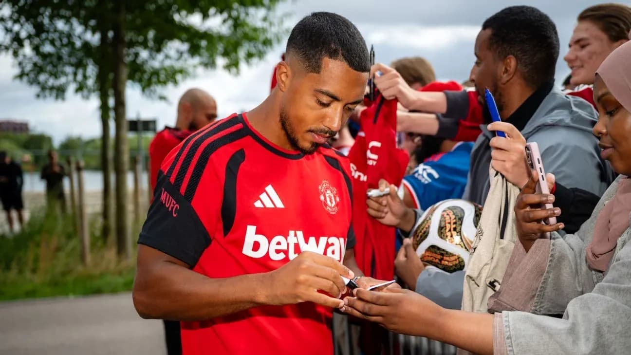 Player signing autographs for fans outside Player signing autographs for fans outside