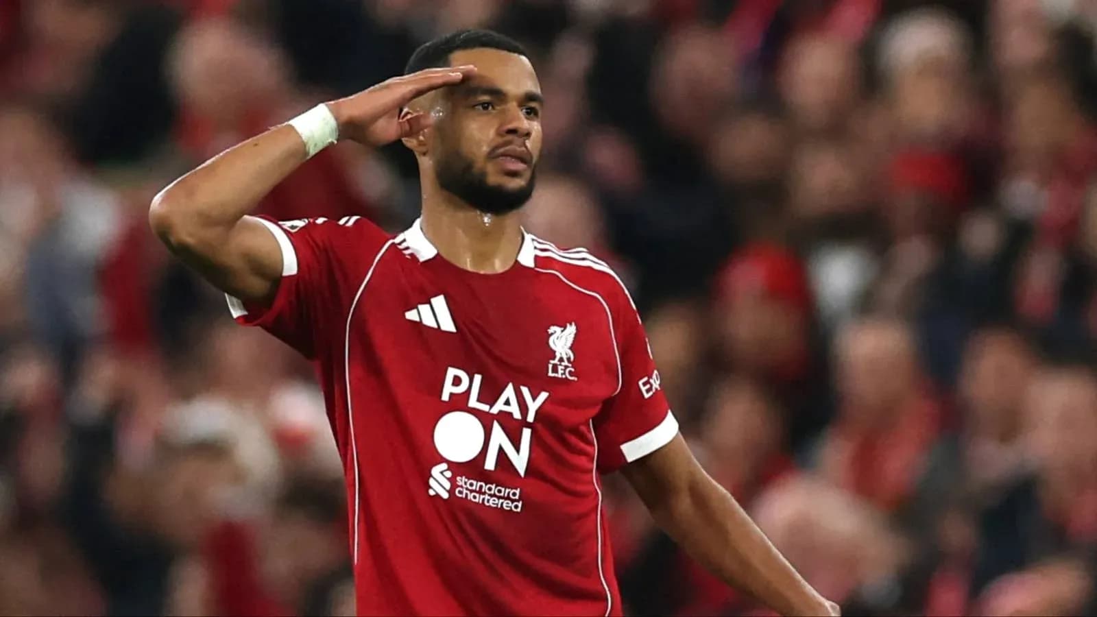 Player saluting fans during Liverpool match Player saluting fans during Liverpool match