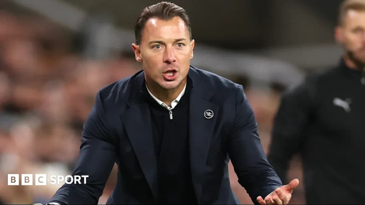 Coach gesturing during a match on the sidelines Coach gesturing during a match on the sidelines
