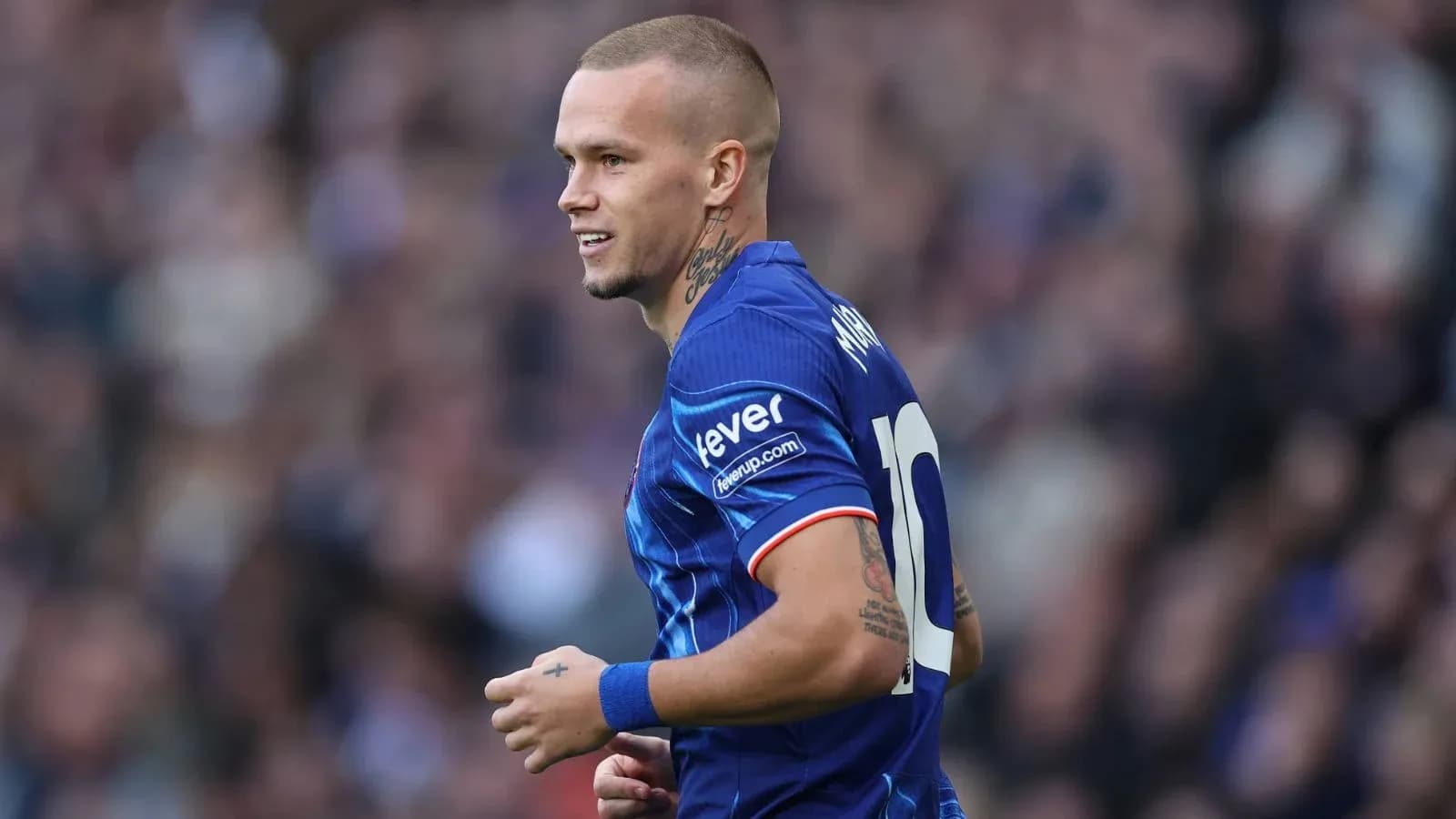 Player in blue jersey celebrating during match Player in blue jersey celebrating during match