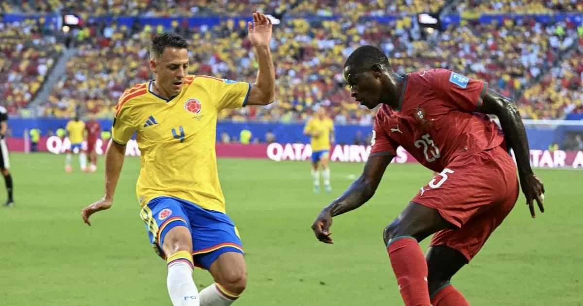 Colombian player tackles opponent during match Colombian player tackles opponent during match