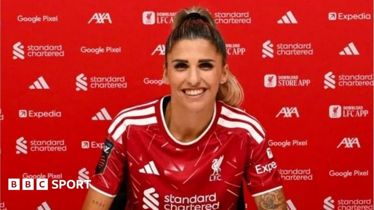 Player wearing Liverpool jersey at press conference Player wearing Liverpool jersey at press conference