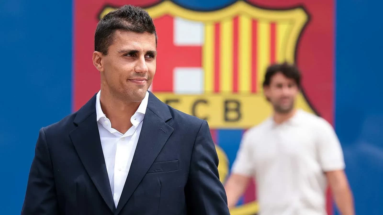 Player posing in front of FC Barcelona logo Player posing in front of FC Barcelona logo