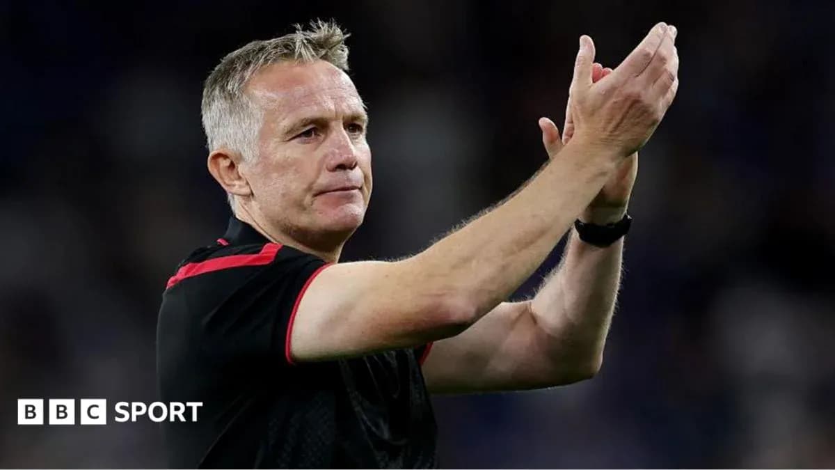 Manager applauding fans after match Manager applauding fans after match