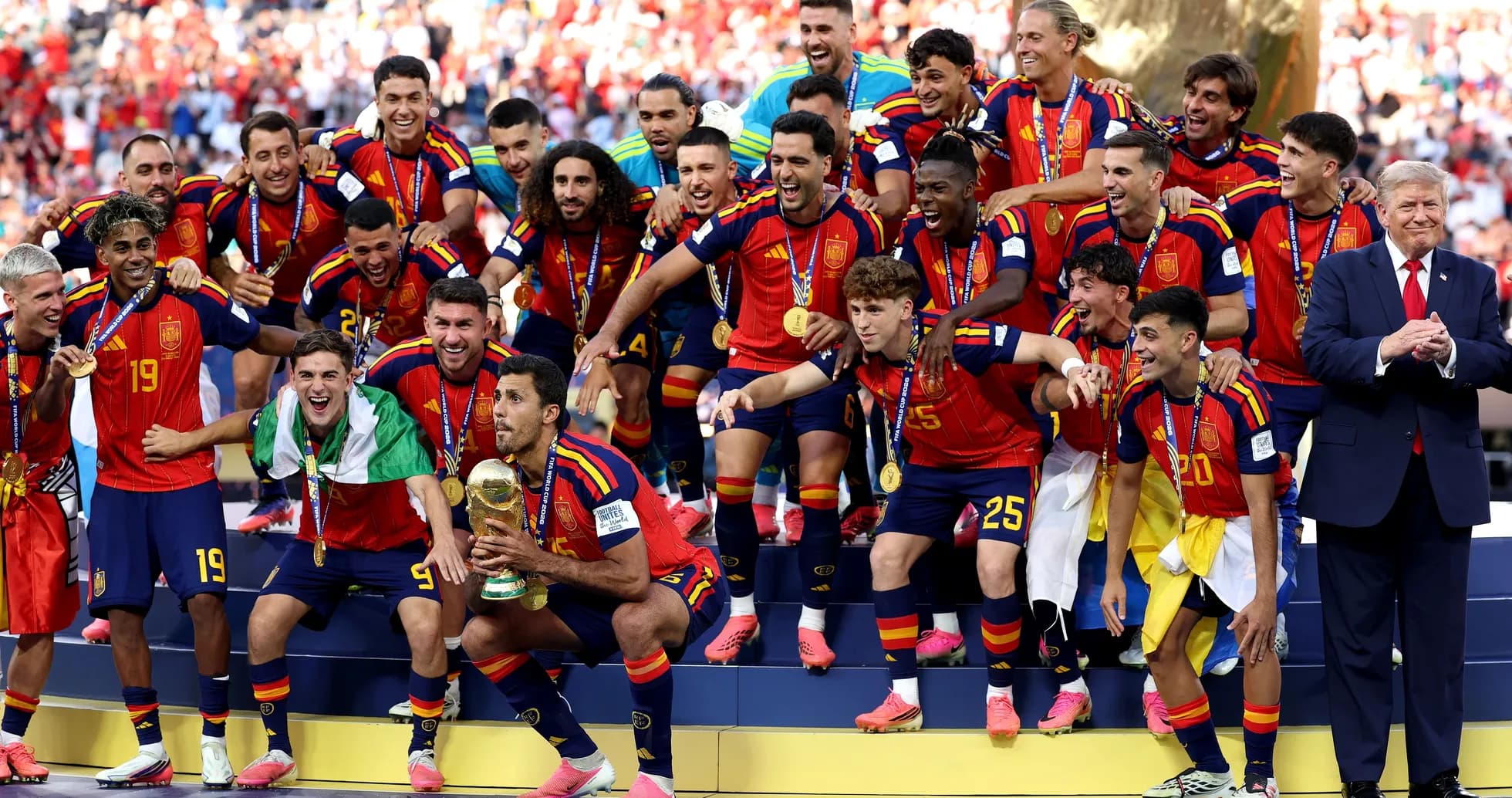 Spain national team celebrating victory with trophy Spain national team celebrating victory with trophy