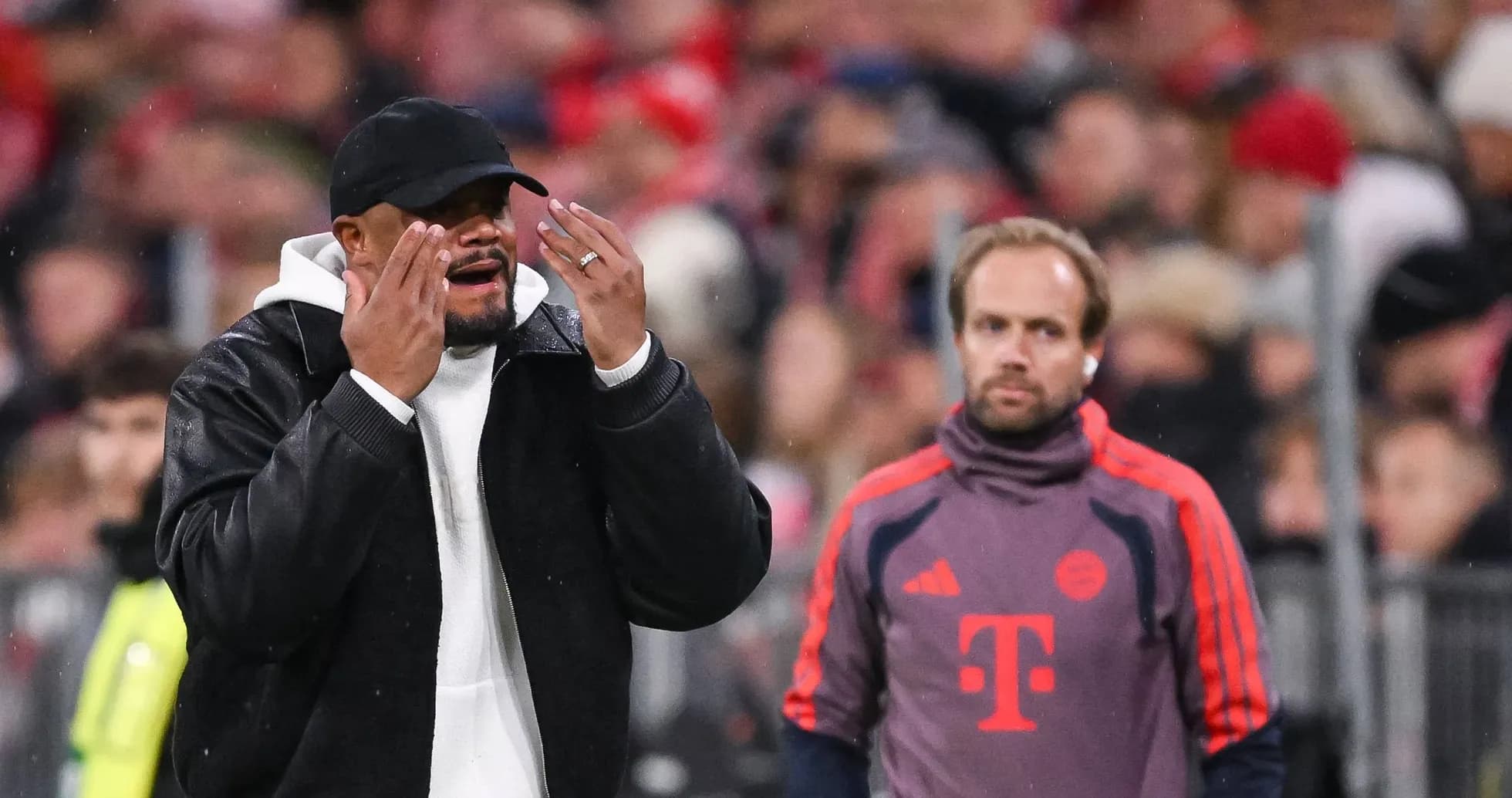 Coach gesturing during match with assistant nearby Coach gesturing during match with assistant nearby
