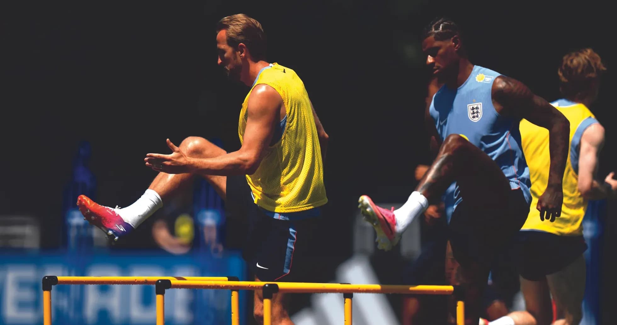 Players training over hurdles during practice session Players training over hurdles during practice session