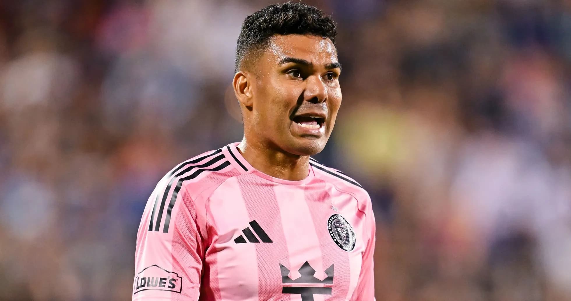 Player in pink jersey arguing during match Player in pink jersey arguing during match