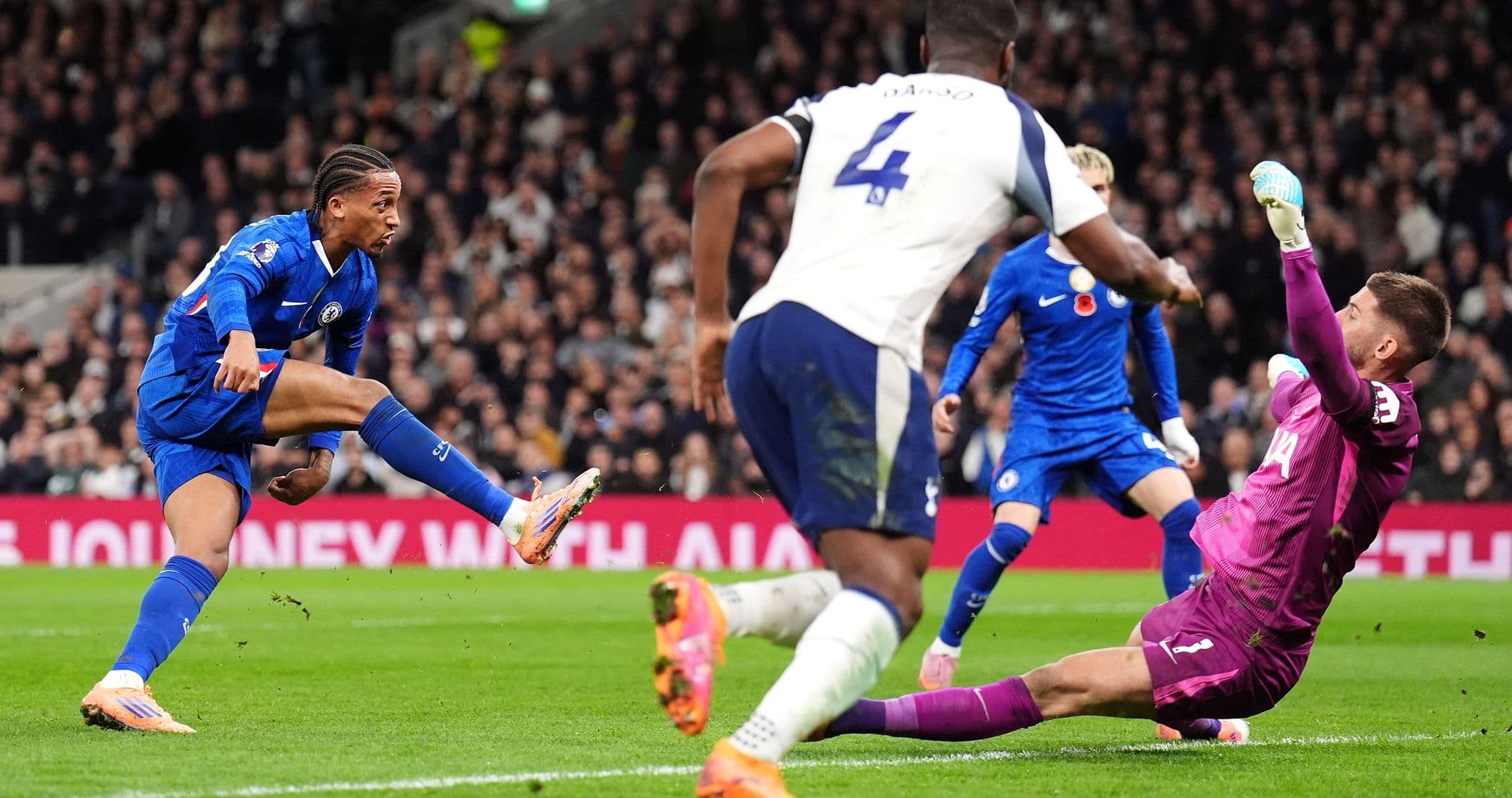 Chelsea player attempting to score against Tottenham Chelsea player attempting to score against Tottenham