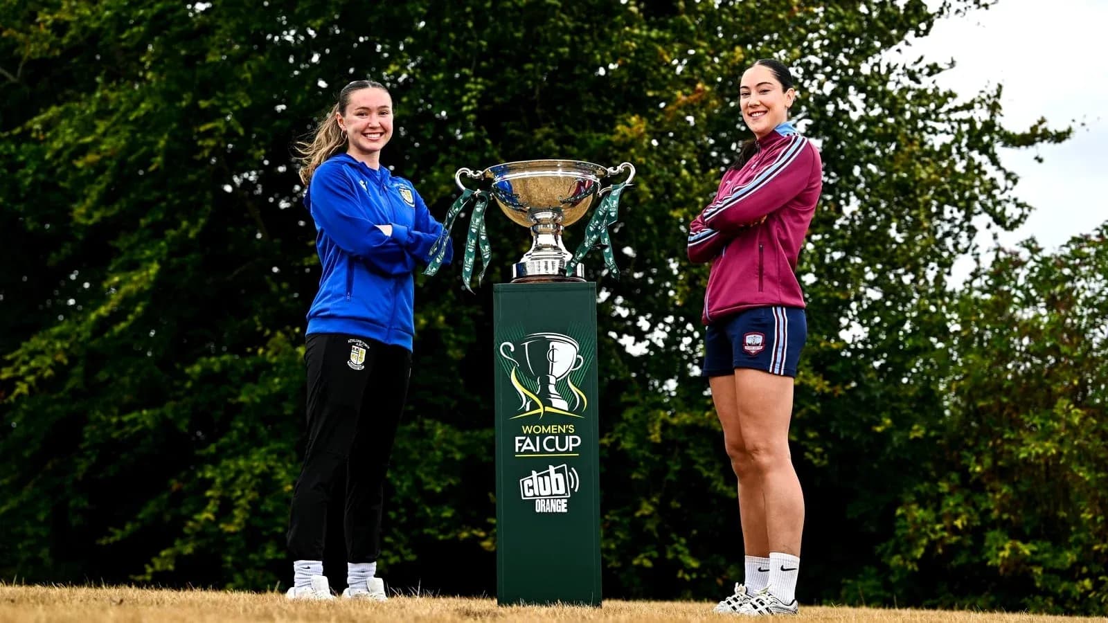 Two female players posing with Women's FAI Cup trophy Two female players posing with Women's FAI Cup trophy