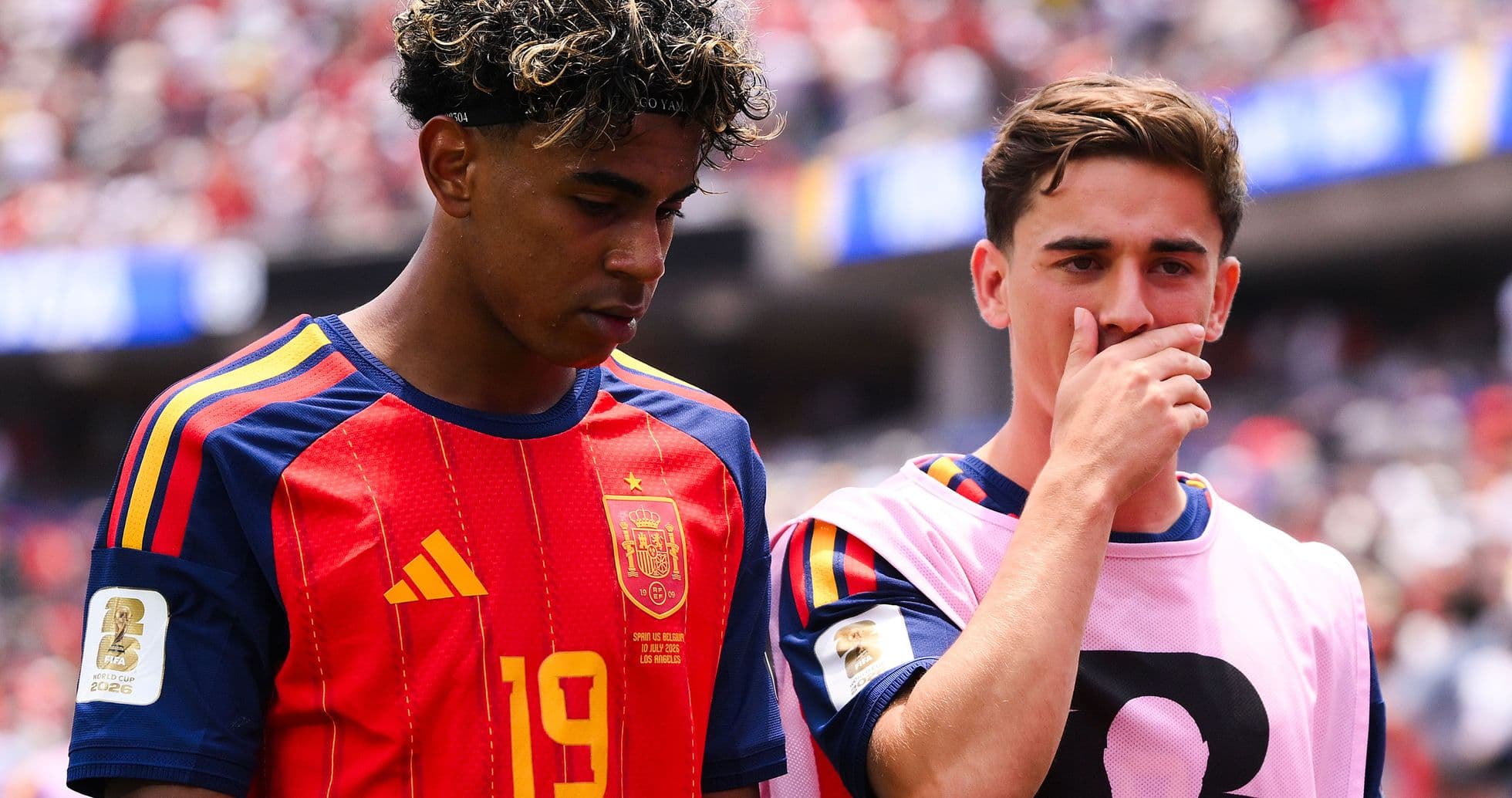 Two Spanish players in jerseys during match Two Spanish players in jerseys during match