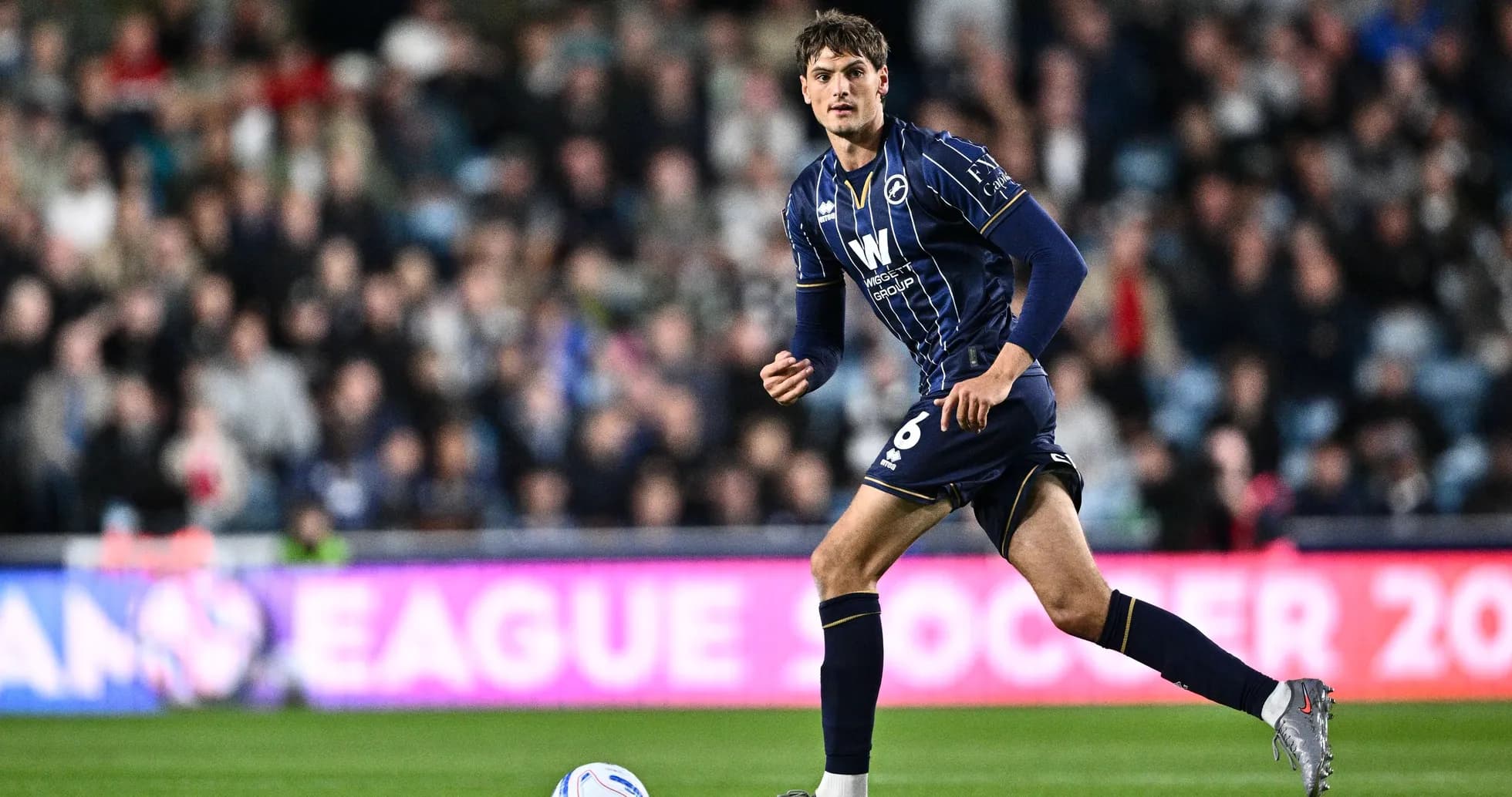 Player in action during a football match Player in action during a football match