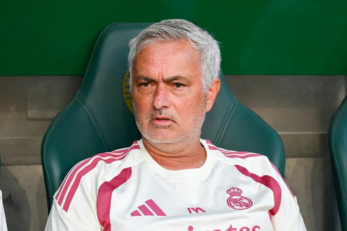 Coach seated on bench during a match Coach seated on bench during a match
